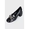 Leather shoes with a silver chain
