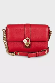 Red leather bag with an accent lock