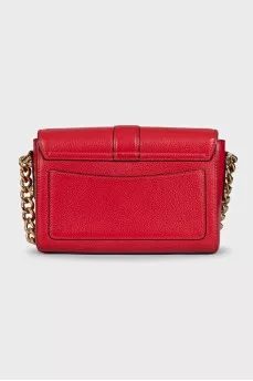 Red leather bag with an accent lock
