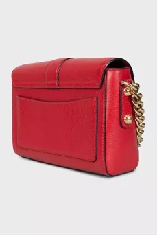 Red leather bag with an accent lock