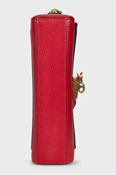 Red leather bag with an accent lock