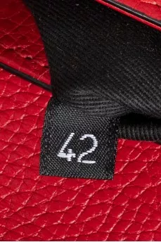 Red leather bag with an accent lock