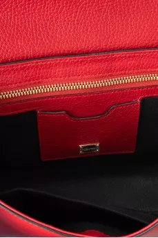 Red leather bag with an accent lock