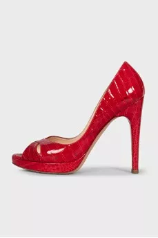 Red shoes decorated with embossing