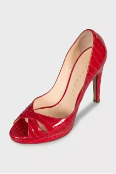Red shoes decorated with embossing