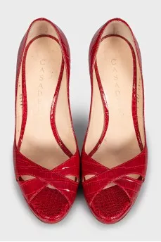 Red shoes decorated with embossing