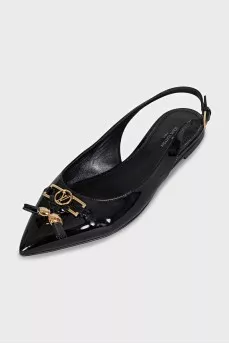 Black patent leather slingbacks with decor