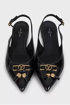 Black patent leather slingbacks with decor