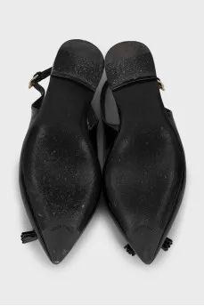Black patent leather slingbacks with decor
