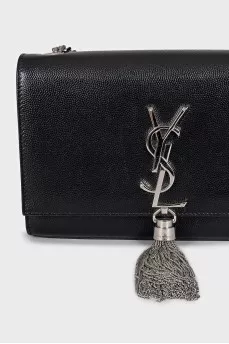 Leather bag decorated with a silver tassel