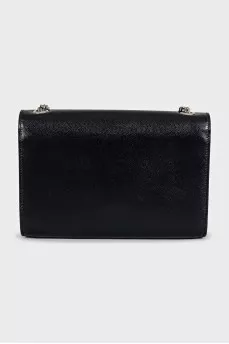 Leather bag decorated with a silver tassel
