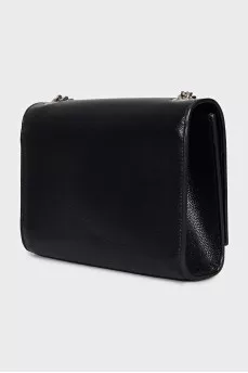 Leather bag decorated with a silver tassel