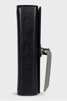 Leather bag decorated with a silver tassel