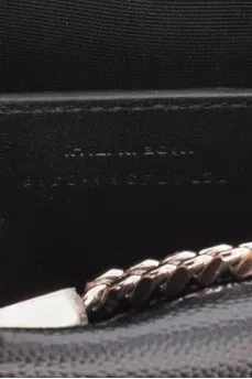 Leather bag decorated with a silver tassel