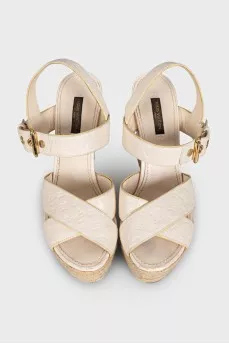 Leather wedge sandals with signature embossing