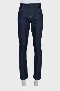 Men's dark blue straight leg jeans with a button