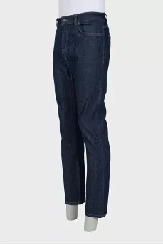 Men's dark blue straight leg jeans with a button