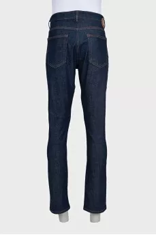 Men's dark blue straight leg jeans with a button