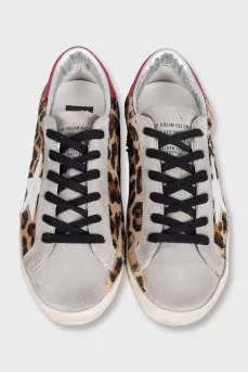 Leather sneakers with animal print