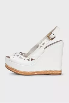 Leather sandals decorated with perforations