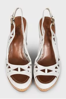 Leather sandals decorated with perforations