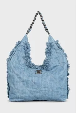 Denim bag decorated with fringe
