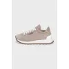 Suede sneakers with branded decor