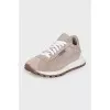 Suede sneakers with branded decor