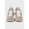 Suede sneakers with branded decor