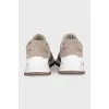 Suede sneakers with branded decor