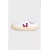 White lace-up sneakers with a red logo
