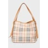 Brown leather bag of a trapezoid shape