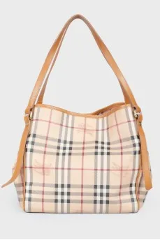 Brown leather bag of a trapezoid shape