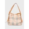 Brown leather bag of a trapezoid shape