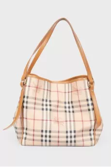 Brown leather bag of a trapezoid shape