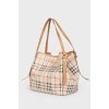 Brown leather bag of a trapezoid shape