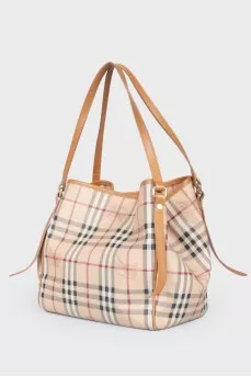 Brown leather bag of a trapezoid shape