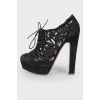 Black suede high-heeled ankle boots
