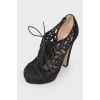 Black suede high-heeled ankle boots
