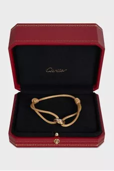 Trinity textile bracelet with a gold pendant
