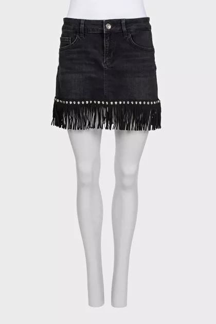 Black denim mini skirt decorated with fringe
