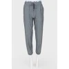Gray sports trousers with tag