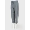 Gray sports trousers with tag