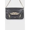 Leather bag with metal decor
