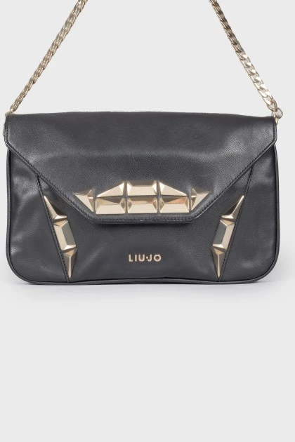 Leather bag with metal decor