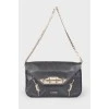 Leather bag with metal decor