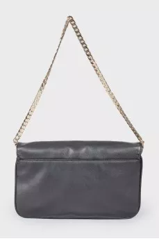 Leather bag with metal decor