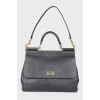 Black leather bag with golden fittings
