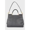 Black leather bag with golden fittings