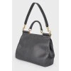 Black leather bag with golden fittings